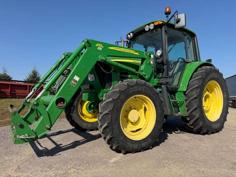 2009 John Deere 6430 Premium MFWD Tractor with a John Deere 673 Loader and Grapple Bucket, 1,917 Hou