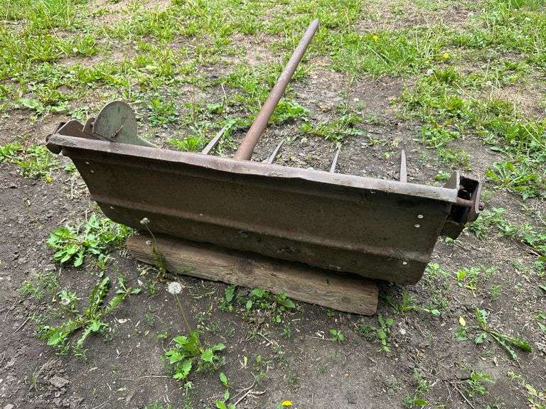 Manure Bucket that was used as a Bale Spear off a 45 Trip Bucket Loader