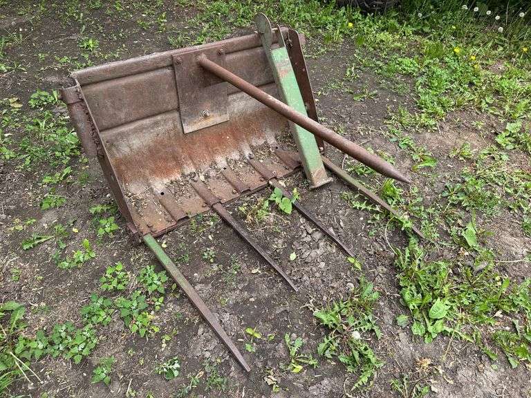 Manure Bucket that was used as a Bale Spear off a 45 Trip Bucket Loader