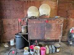 Oil Container Rack with 2 – 70 Gallon Poly Tanks, Used for Oil, and Cabinet with Misc Containers, Fi