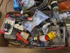 Assortment of Electrical Parts and Paint Cans