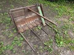 Manure Bucket that was used as a Bale Spear off a 45 Trip Bucket Loader