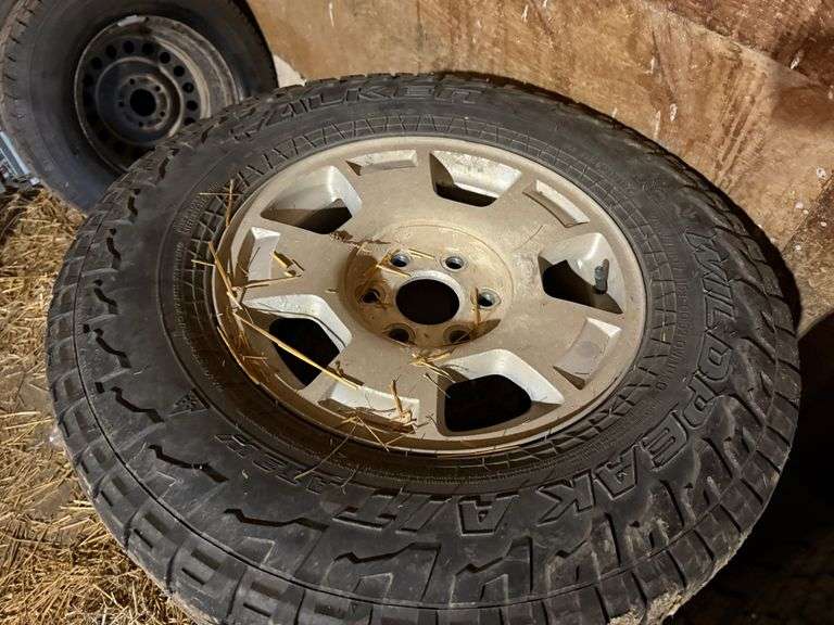 (4) Falken Wildpeak 265/70R17 Tire on Chevrolet Rim, Buying All for One Money