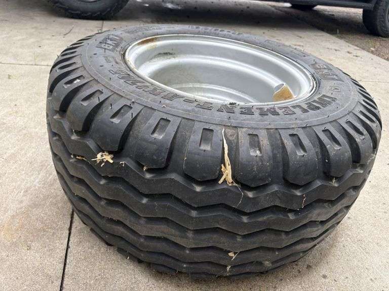 BKT 15.0/55-17 Tire on 6 Bolt Rim, off of Kubota Round Baler