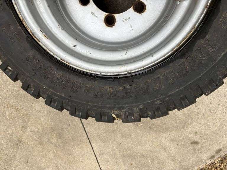 BKT 15.0/55-17 Tire on 6 Bolt Rim, off of Kubota Round Baler