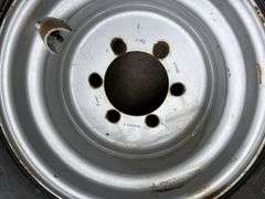 BKT 15.0/55-17 Tire on 6 Bolt Rim, off of Kubota Round Baler