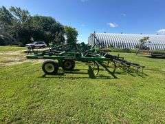 John Deere 680 Chisel Plow, 25’ Wide, Fold up Wings, Walking Tandems, 3 Bar Harrow, SN: 002635