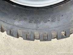 BKT 15.0/55-17 Tire on 6 Bolt Rim, off of Kubota Round Baler
