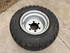 BKT 15.0/55-17 Tire on 6 Bolt Rim, off of Kubota Round Baler