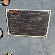 2025 Starvox SV-ME12 1-Ton Mini-Excavator with dozer blade (New/Unused) (Est. Retail Value $17,000).