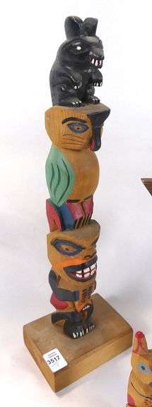 CARVED TOTEM POLES