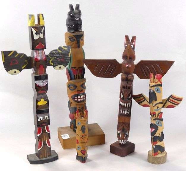 CARVED TOTEM POLES