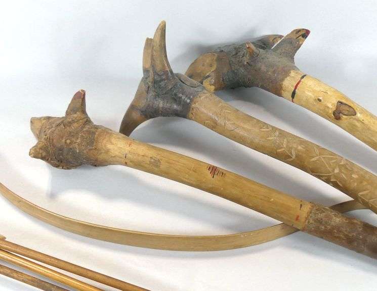 CARVED WOODEN CLUBS, BOW & ARROWS, ETC.