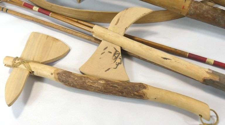 CARVED WOODEN CLUBS, BOW & ARROWS, ETC.