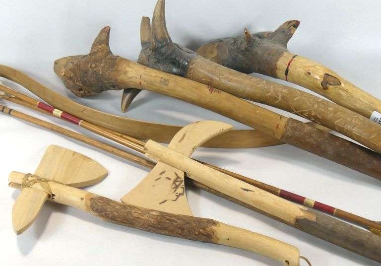 CARVED WOODEN CLUBS, BOW & ARROWS, ETC.