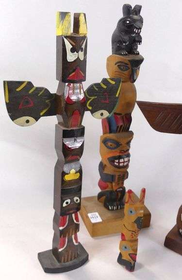 CARVED TOTEM POLES