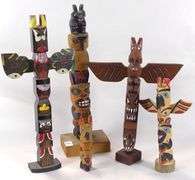 CARVED TOTEM POLES