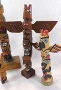 CARVED TOTEM POLES