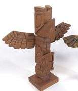 TWO CARVED TOTEM POLES