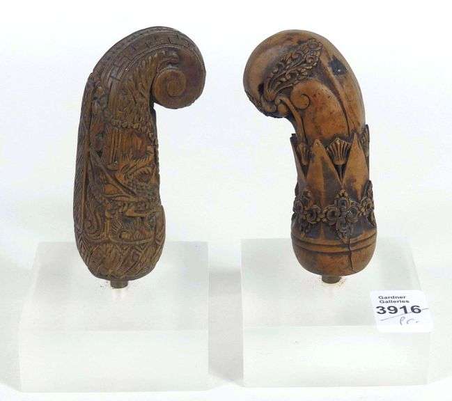 PAIR CARVED WOODEN HILTS