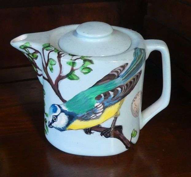 FOUR HAND-PAINTED TEAPOTS