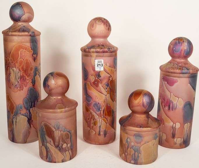 FIVE PIECE GRADUATED ART GLASS JAR SET