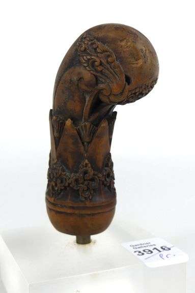 PAIR CARVED WOODEN HILTS