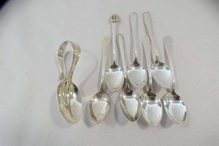 EIGHT STERLING SILVER SPOONS