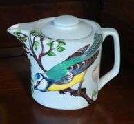 FOUR HAND-PAINTED TEAPOTS