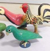 FIVE WOODEN "BIRD" CARVINGS