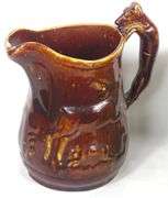 FOUR ANTIQUE STONEWARE PITCHERS