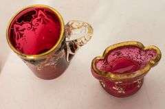 FOUR PIECES OF CRANBERRY GLASS