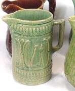 FOUR ANTIQUE STONEWARE PITCHERS