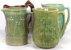 FOUR ANTIQUE STONEWARE PITCHERS