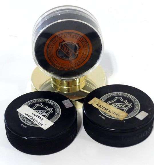 THREE AUTOGRAPHED HOCKEY PUCKS