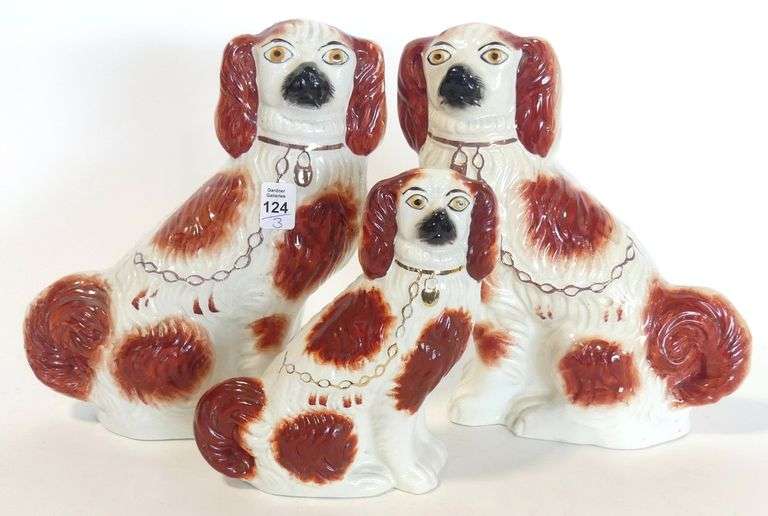 THREE STAFFORDSHIRE DOG FIGURINES