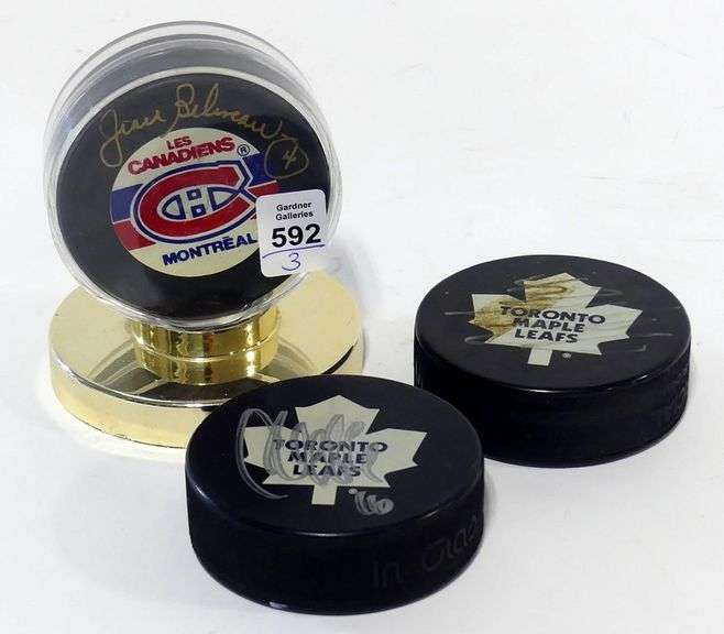 THREE AUTOGRAPHED HOCKEY PUCKS