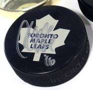 THREE AUTOGRAPHED HOCKEY PUCKS