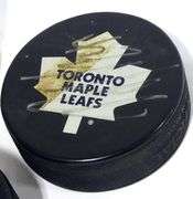 THREE AUTOGRAPHED HOCKEY PUCKS