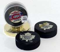 THREE AUTOGRAPHED HOCKEY PUCKS