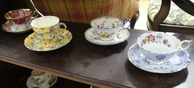 TWELVE ENGLISH CUPS AND SAUCERS