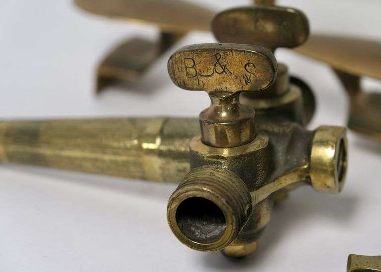 BRASS SPIGOTS AND BUTTER PRESS