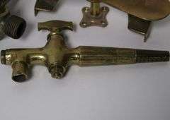 BRASS SPIGOTS AND BUTTER PRESS