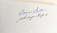 TWO AUTOGRAPHED BOOKS