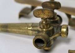BRASS SPIGOTS AND BUTTER PRESS