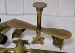 BRASS SPIGOTS AND BUTTER PRESS