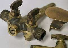 BRASS SPIGOTS AND BUTTER PRESS