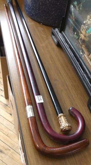 TWO WALKING STICKS AND CANE
