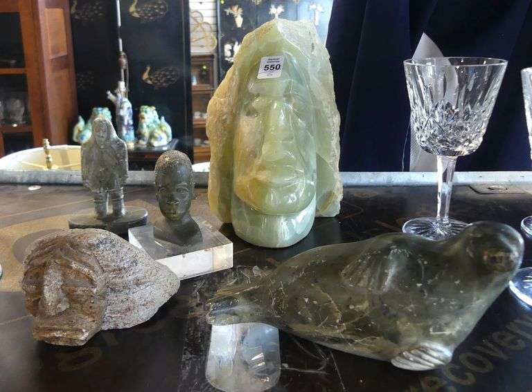 FIVE STONE CARVINGS AND PLAQUE