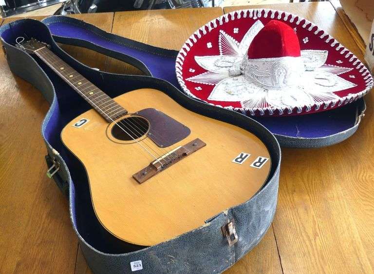 ACOUSTIC GUITAR AND SOMBRERO
